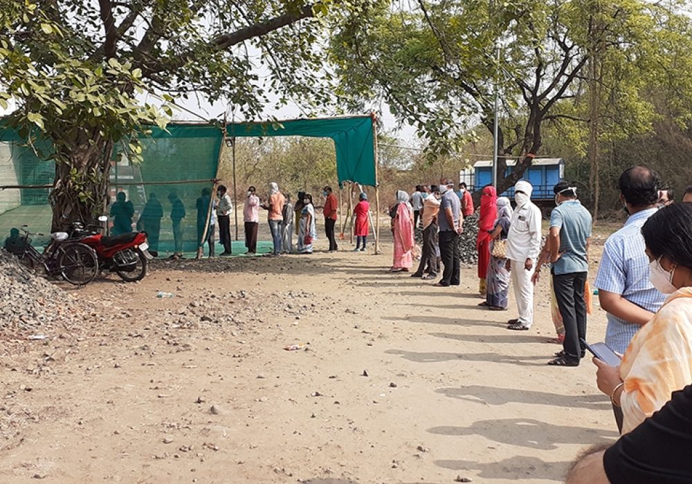COVID-19 vaccination line in Nagpur, India, May 2021. CREDIT: <a href="https://en.wikipedia.org/wiki/File:COVID-19_vaccination_queue_01052021.jpg">Ganesh Dhamodkar/Wikimedia</a> <a href="https://creativecommons.org/licenses/by-sa/4.0/deed.en">(CC)</a>
