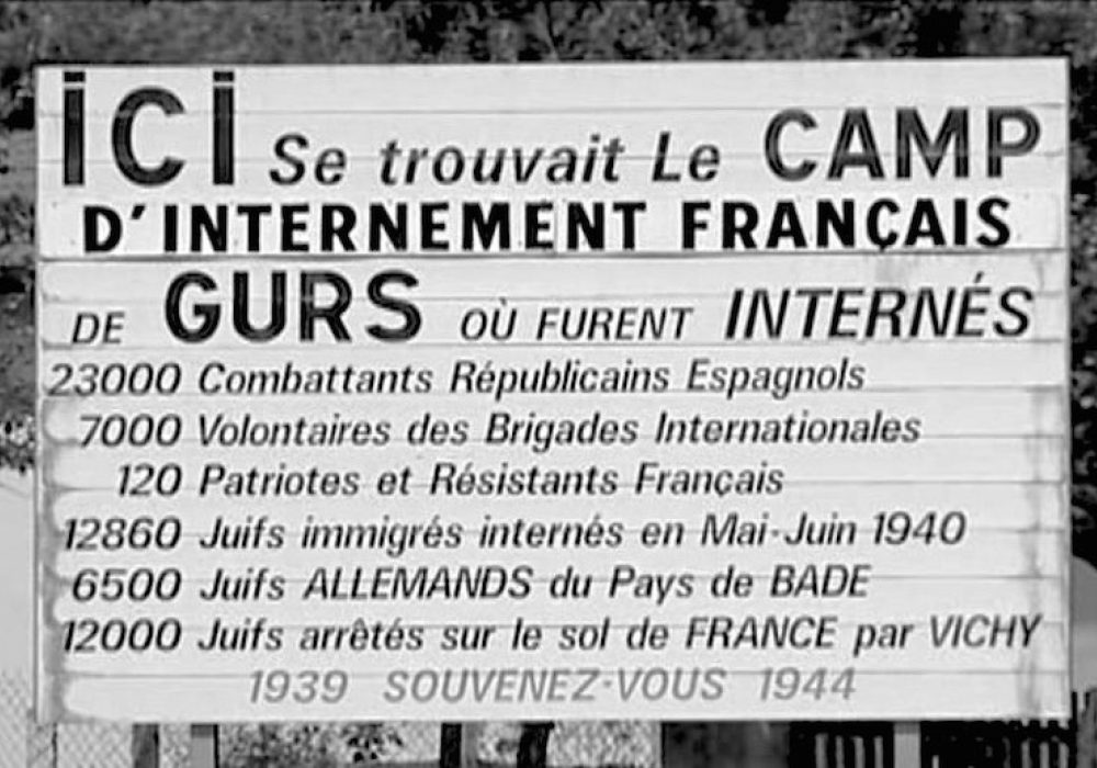 Memorial sign at the Gurs Internment Camp, Southwest France, listing the groups imprisoned there. CREDIT: <a href="https://commons.wikimedia.org/wiki/File:Camp_de_Gurs_panneau_m%C3%A9moriel_1980.jpg"> Claude Truong-Ngoc</a> ,1980. (<a href="https://creativecommons.org/licenses/by-sa/3.0/deed.en">CC</a>)