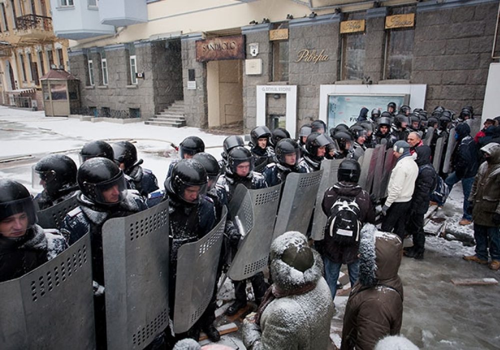 <a href="http://www.shutterstock.com/pic-172917470/stock-photo-kiev-ukraine-jan-police-squads-protect-the-government-quarter-of-the-common-people-on-the.html?src=tuJuBM6qfJGPSjK4MMwu1A-1-3">Police and Protesters, Kiev, Jan 2014</a> via Shutterstock