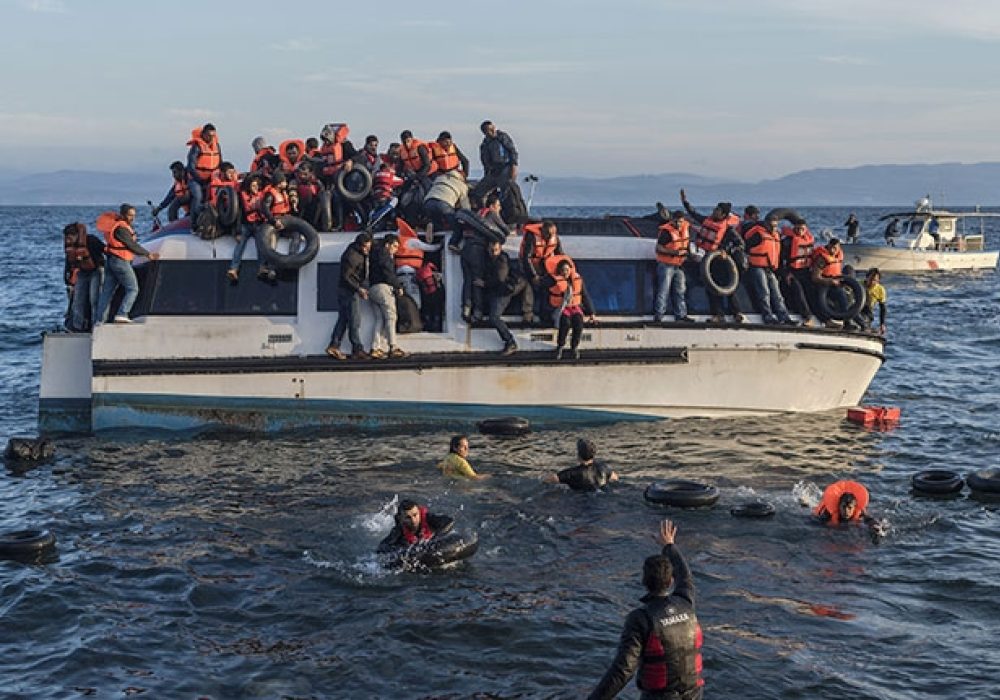 CREDIT: <a href="https://commons.wikimedia.org/wiki/File:20151030_Syrians_and_Iraq_refugees_arrive_at_Skala_Sykamias_Lesvos_Greece_2.jpg" target="_blank">Ggia - Wikimedia (CC)</a>. Syrian and Iraqi refugees arrive at Lesvos, Greece, October 2015.
