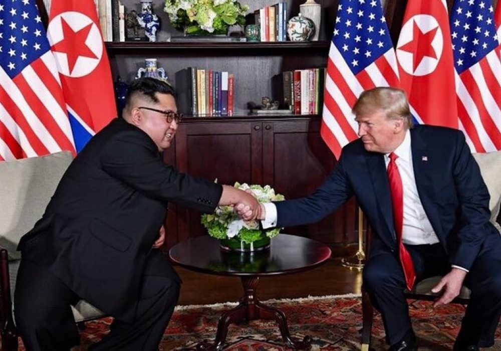 DPRK–USA Singapore Summit,  June 12, 2018. CREDIT: <a href="https://commons.wikimedia.org/wiki/File:Trump_and_Kim_shaking_hands_in_the_summit_room.jpg">Dan Scavino Jr.</a> via Wikipedia, Public Domain