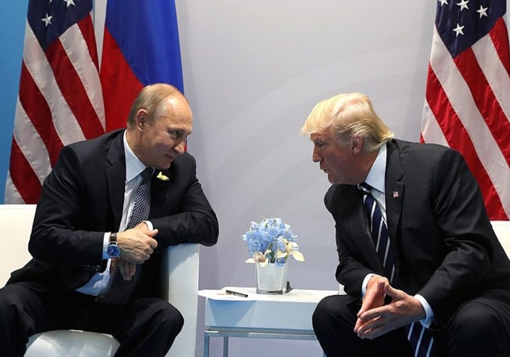 Vladimir Putin and Donald Trump at the 2017 G-20 summit in Hamburg, Germany, July 2017. CREDIT: <a href="https://commons.wikimedia.org/wiki/File:Vladimir_Putin_and_Donald_Trump_at_the_2017_G-20_Hamburg_Summit_(3).jpg">Kremlin.ru (CC)</a>
