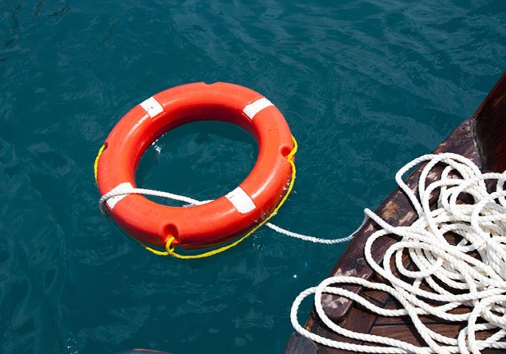 CREDIT: Life Preserver via <a href="http://www.shutterstock.com/pic-105062843/stock-photo-safe-water-support-aid-circle-with-rope-rescue-red-life-buoy-on-wooden-background-of-ship-or-boat.html?src=lb-21249545">Shutterstock</a>