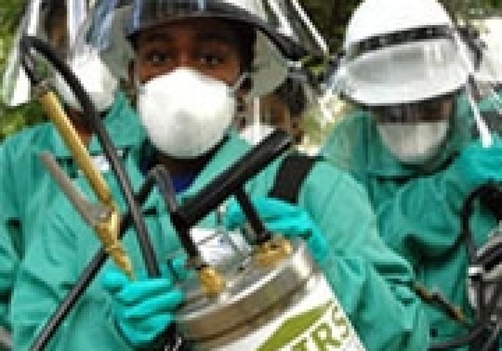 Spraying insecticide house-to-house in <br>Zanzibar. Source: Kimberly Wylie, <br>USAID/Tanzania (<a href="http://www.fightingmalaria.gov/countries/index.html">PD</a>).