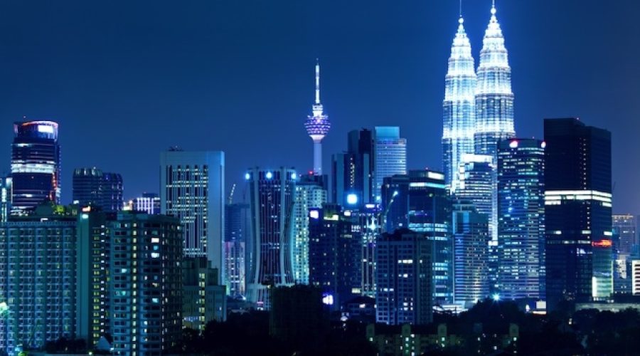 Skyline of Kuala Lumpur, Malaysia via <a href="http://www.shutterstock.com/pic-149398187/stock-photo-kuala-lumpur-skyline-at-night.html">Shutterstock</a>