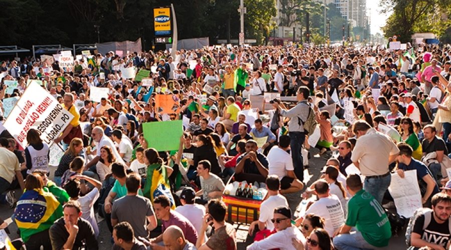 Protesters in Sao Paulo in June 2013 via <a href="http://www.shutterstock.com/pic-190374902/stock-photo-sao-paulo-brazil-june-some-protesters-marching-on-paulista-avenue-holding-signs-with.html?src=9bHtQcDaZEdt6k_Tqv-RUw-1-12">Shutterstock</a>