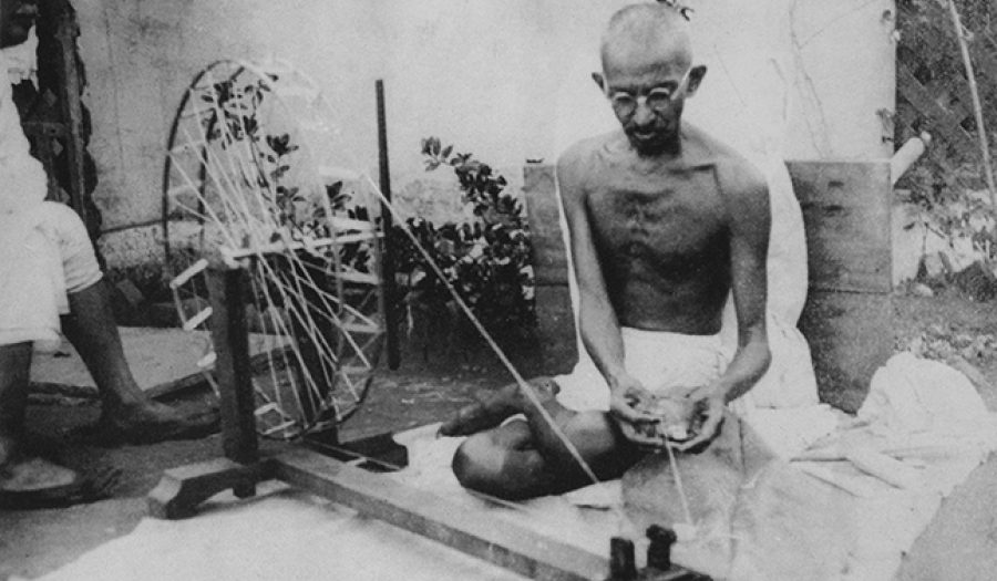 Mahatma Gandhi spinning yarn, in the late 1920s. Public Domain via <a href="http://en.wikipedia.org/wiki/Mahatma_Gandhi#/media/File:Gandhi_spinning.jpg">Wikipedia</a>