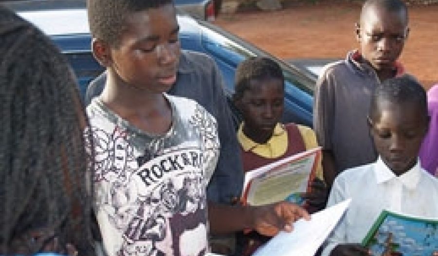Ex-child soldier in Uganda reads to his comrades. <br>CREDIT: <a href="http://www.flickr.com/photos/18199113@N02/1986610953/in/photostream/" target=_blank">Robin Yamaguchi </a>