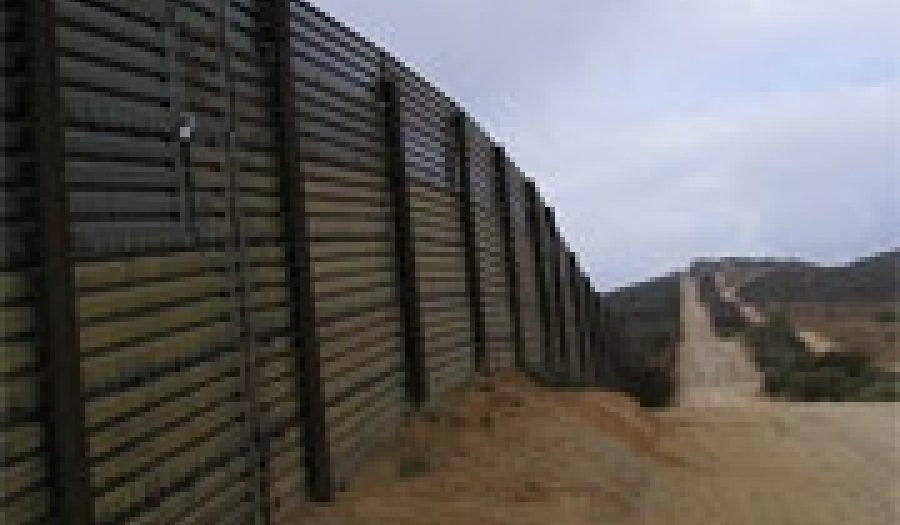 Fence along the U.S.-Mexico border. <br>Photo by <a href="http://www.flickr.com/photos/16216900@N00/174045778/" target=_blank>Edmond Meinfelder</a> (<a href="http://creativecommons.org/licenses/by/2.0/deed.en-us" target=_blank>CC</a>).