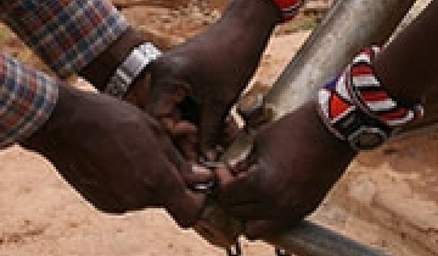 A village well in Kenya is locked for <br>conservation purposes. Photo by <a href="http://flickr.com/photos/davida3/484971270/">Davida <br>De La Harpe</a> (<a href="http://creativecommons.org/licenses/by-nc-nd/2.0/deed.en">CC</a>).