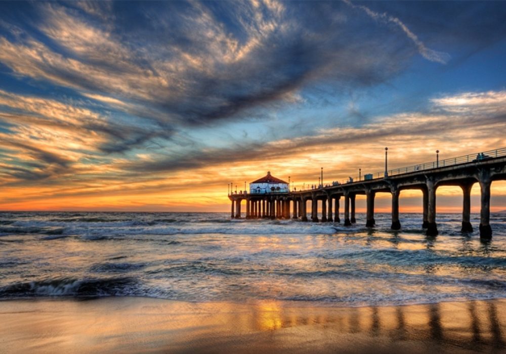 Photo of pier at sunset by Pedro Szekely,