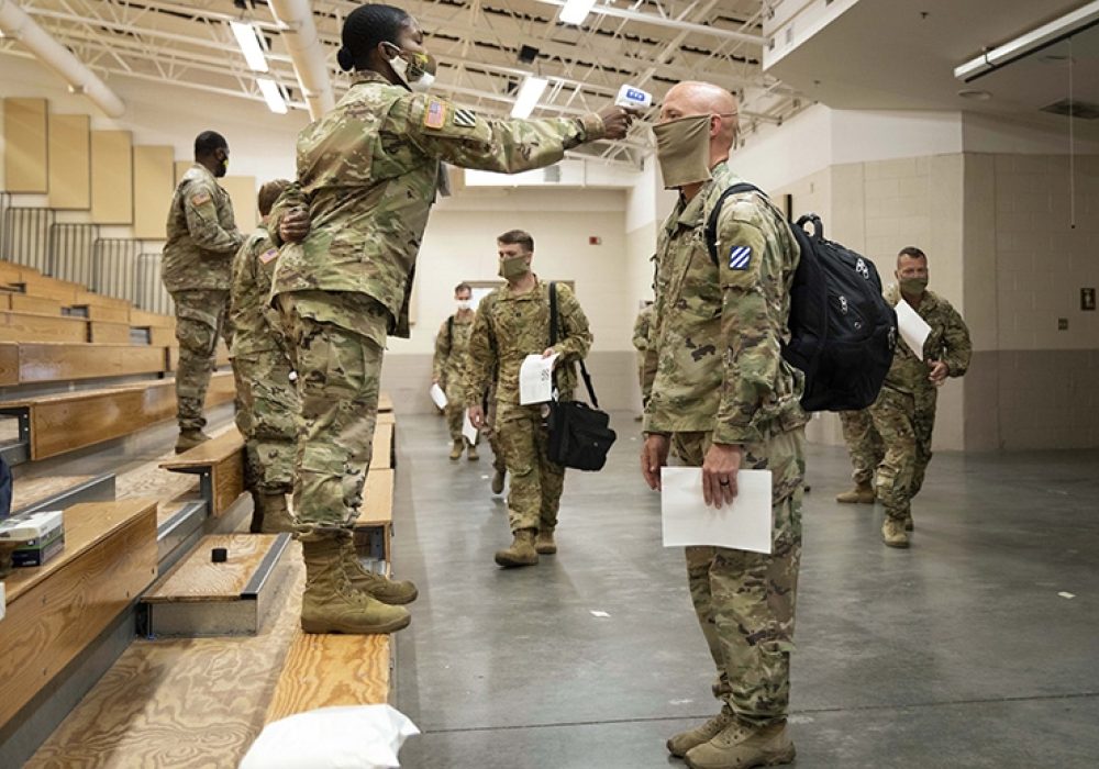 Soldiers returning from Europe. Hunter Army Airfield, Georgia, June 28, 2020, CREDIT: <a href=https://www.defense.gov/observe/photo-gallery/igphoto/2002338683/>U.S. Department of Defense</a>.