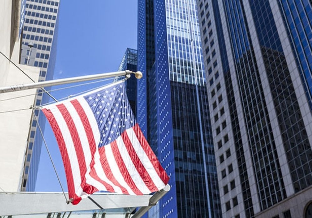 CREDIT: <a href="- http://www.shutterstock.com/pic-231458125/stock-photo-american-flag-in-the-city.html">Shutterstock</a>