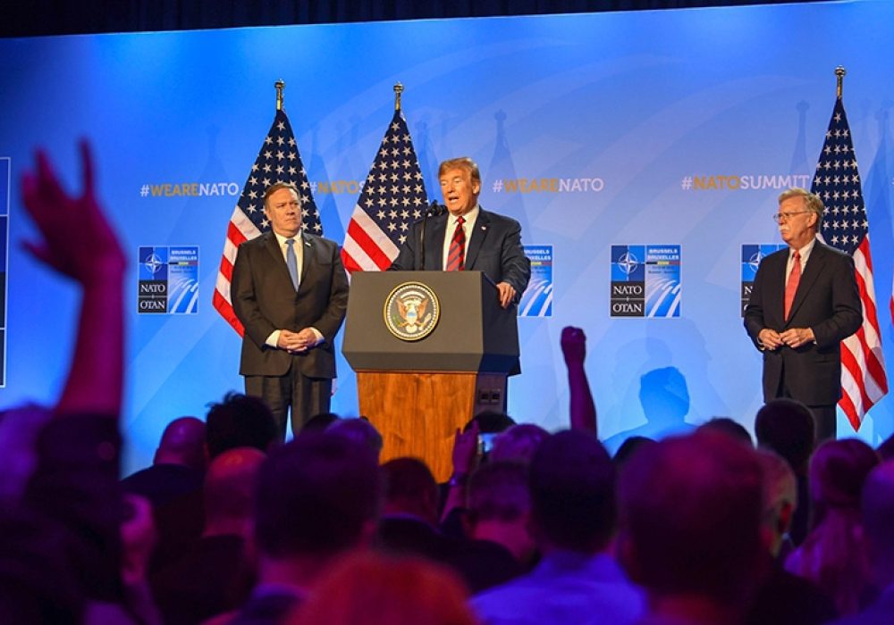 Secretary of State Pompeo & President Trump at NATO headquarters, Brussels, Belgium, July 2018. CREDIT: <a href=https://commons.wikimedia.org/wiki/File:Secretary_Pompeo_Participates_in_Press_Conference_With_President_Trump_at_NATO_(42456753975).jpg>U.S. Department of State (CC)</a>