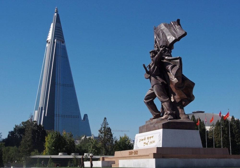 Ryugyong Hotel and Victorious Fatherland Liberation War Museum, Pyongyang, North Korea. CREDIT: <a href="https://commons.wikimedia.org/wiki/File:Victorious_Fatherland_Liberation_War_Museum_and_Ryugyong_Hotel_(11342673725).jpg">Clay Gilliland (CC)</a>