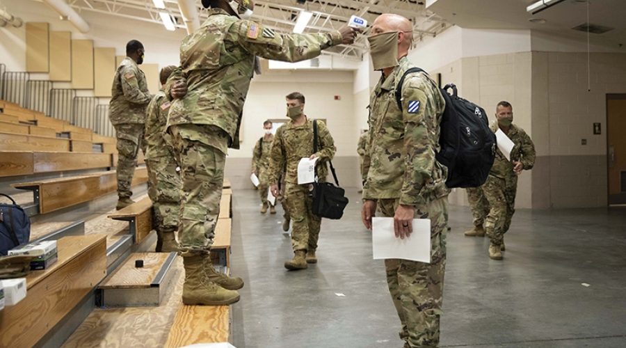 Soldiers returning from Europe. Hunter Army Airfield, Georgia, June 28, 2020, CREDIT: <a href=https://www.defense.gov/observe/photo-gallery/igphoto/2002338683/>U.S. Department of Defense</a>.