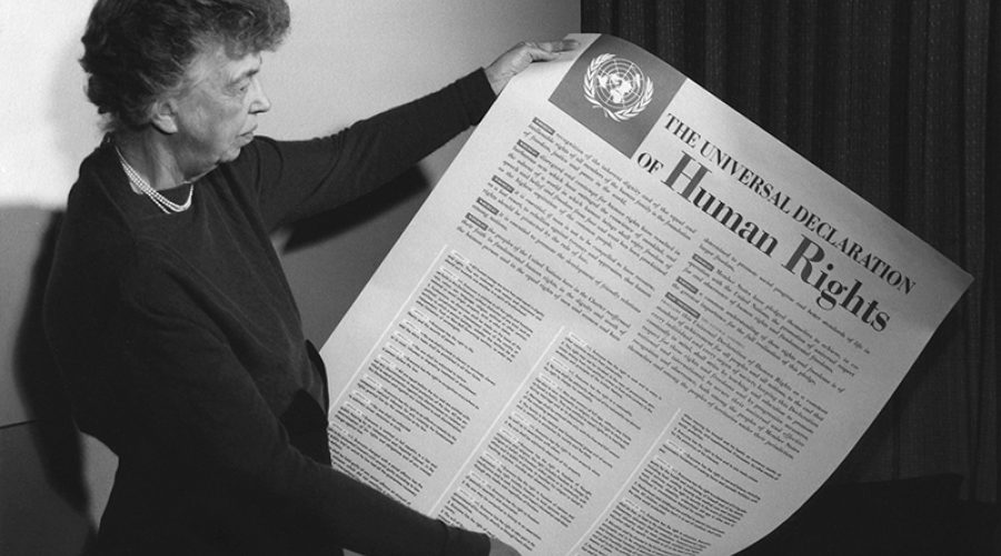 Eleanor Roosevelt holding a poster of the Universal Declaration of Human Rights, Lake Success, NY, November, 1949. <br>CREDIT: <a href="https://en.wikipedia.org/wiki/Universal_Declaration_of_Human_Rights#/media/File:Eleanor_Roosevelt_UDHR.jpg">Wikimedia</a> <a href="https://creativecommons.org/licenses/by/2.0/deed.en">(CC)</a>