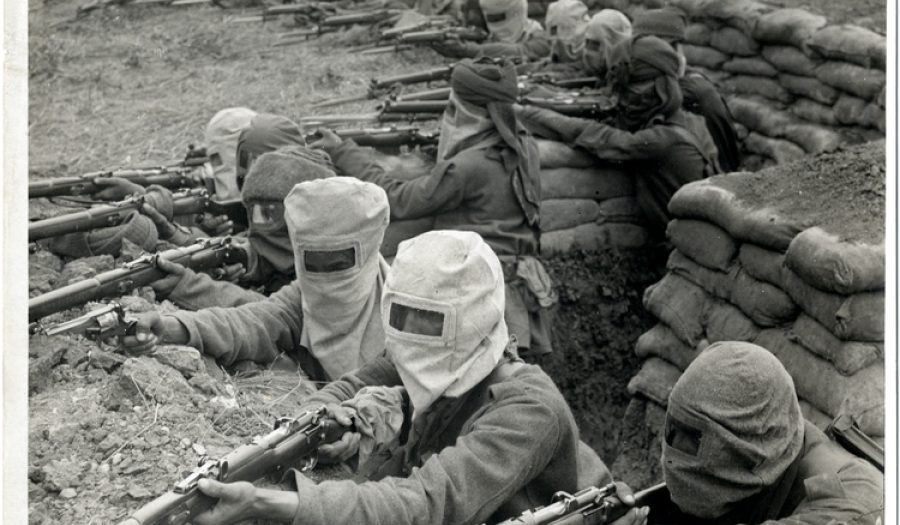 Indian infantry (58th Rifles) in Fauquissart, France, August 1915. CREDIT: <a href="https://commons.wikimedia.org/wiki/File:Indian_infantry_in_the_trenches,_prepared_against_a_gas_attack_(Photo_24-300).jpg">H. D. Girdwood/British Library/Public Domain</a>