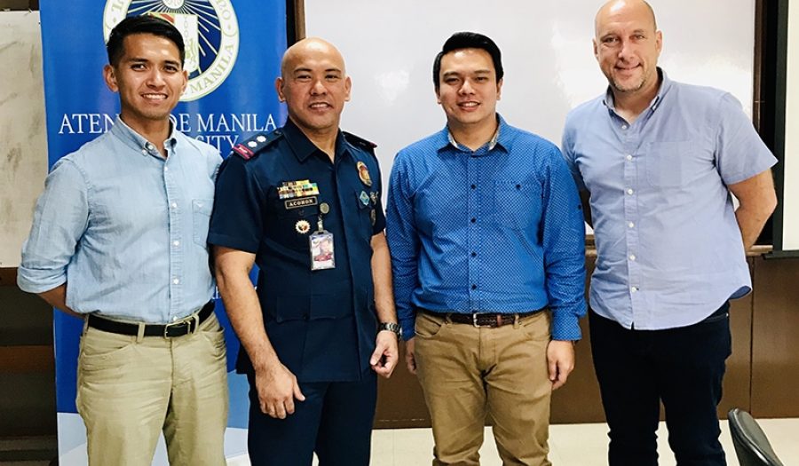 Mark Payumo in Manila last October with a Philippine National Police Officer, Pacific Fellow Tom Temprosa, & Devin Stewart. <br>CREDIT: Amanda Ghanooni.