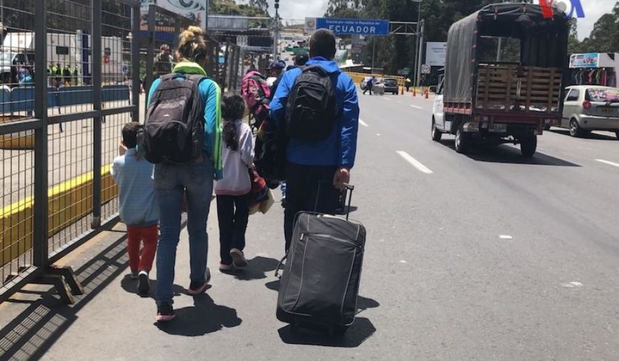 A Venezuelan family at the Colombia/Ecuador border, August 2018. CREDIT: <a href="https://commons.wikimedia.org/wiki/File:This_Venezuelan_family_hopes_to_cross_the_border_between_Ecuador_and_Colombia_on_their_return_trip_to_Venezuela.jpg">Voice of America/Public Domain</a>
